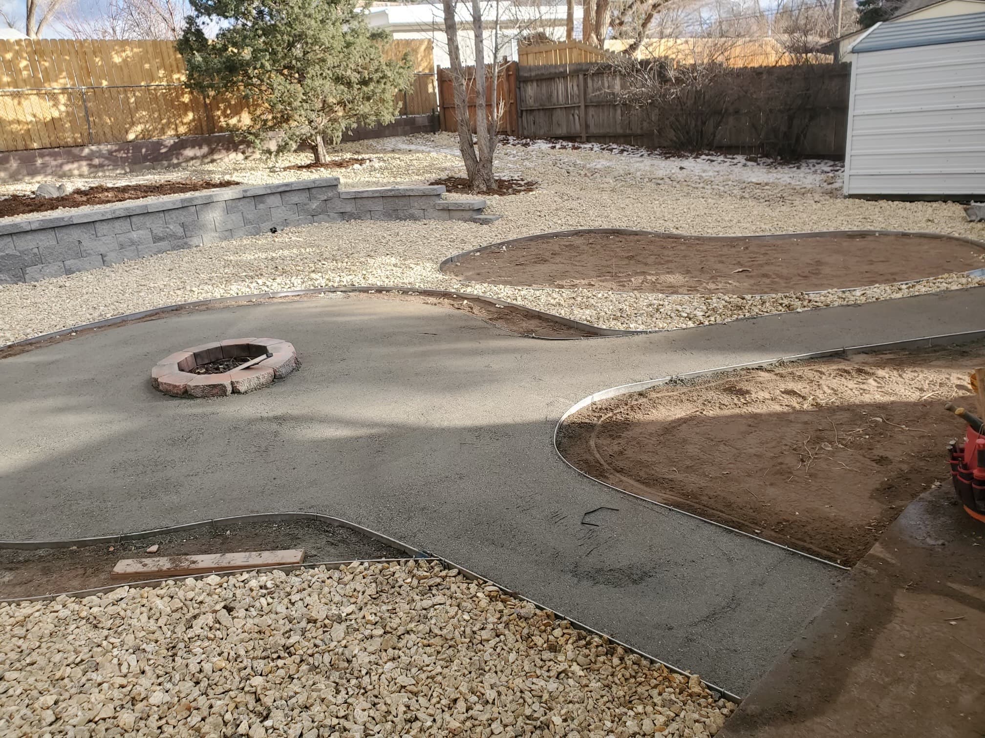 Natural flagstone steps with retaining wall and mulch beds