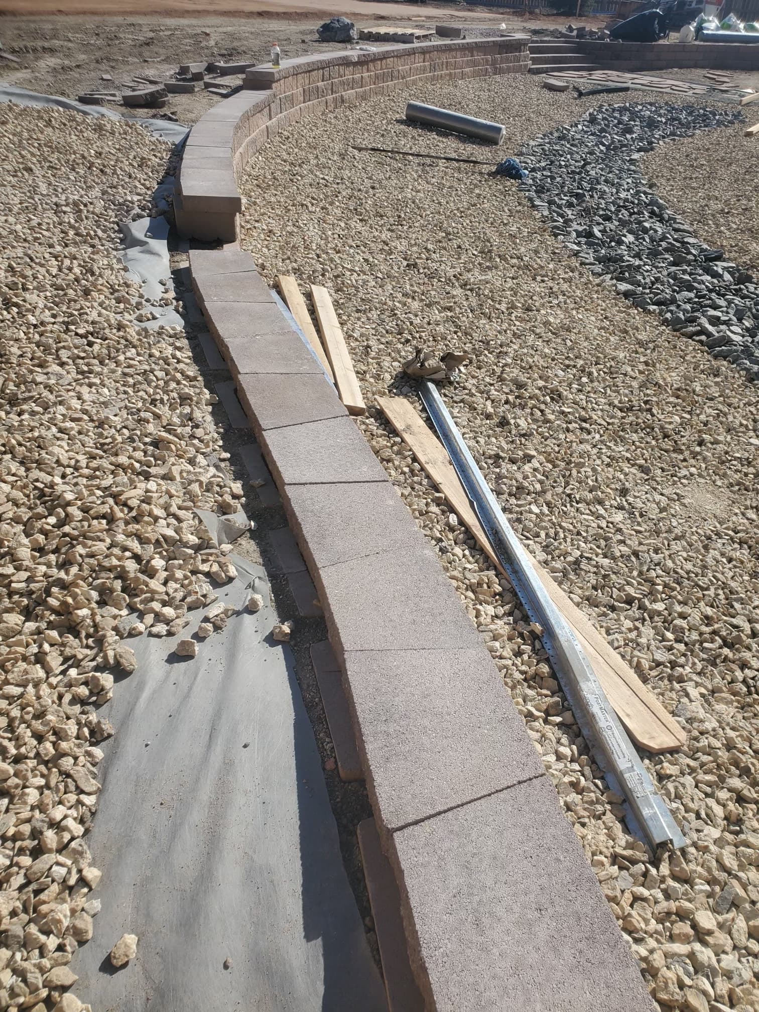 Block border edging with gravel drainage installation